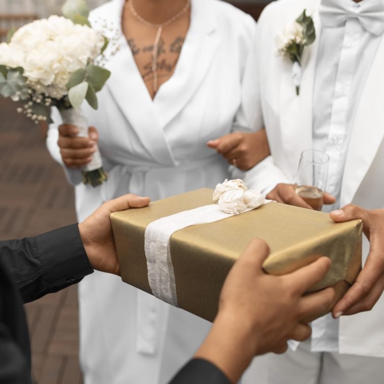 lesbian-couple-accepting-gifts-from-guests-their-wedding